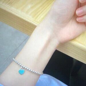 Tiffany & Co. Silver Bracelet with Blue Heart Charm